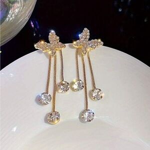 Elegant Gold Butterfly Drop Earrings with Three Drop Down Diamonds